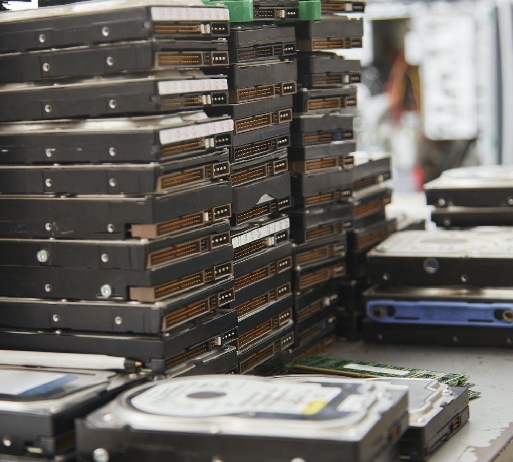 Old computer hard disks in recycling plant